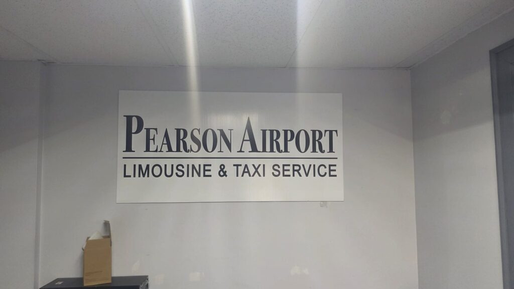 Pearson Airport Limousine and Taxi Service sign inside the Mississauga office