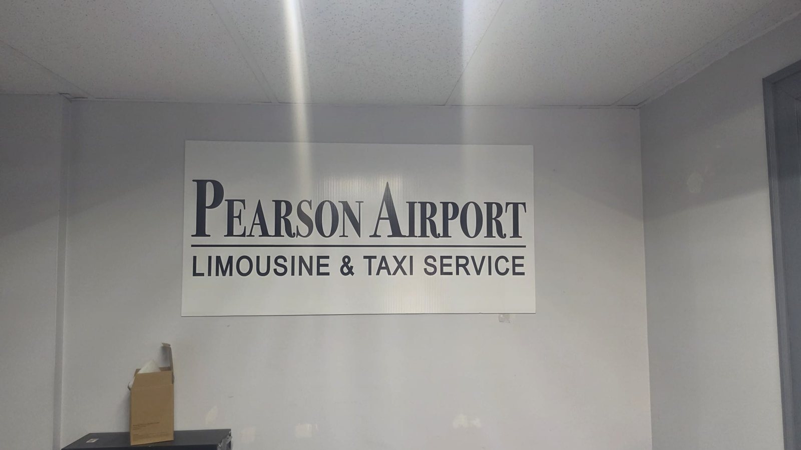 Pearson Airport Limousine and Taxi Service sign inside the Mississauga branch office